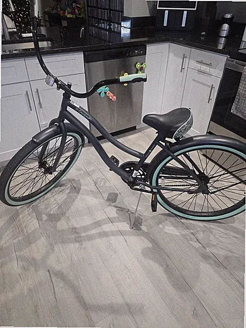 Huffy 26-inch Cranbrook comfort cruiser bike in gray with mint green accents.